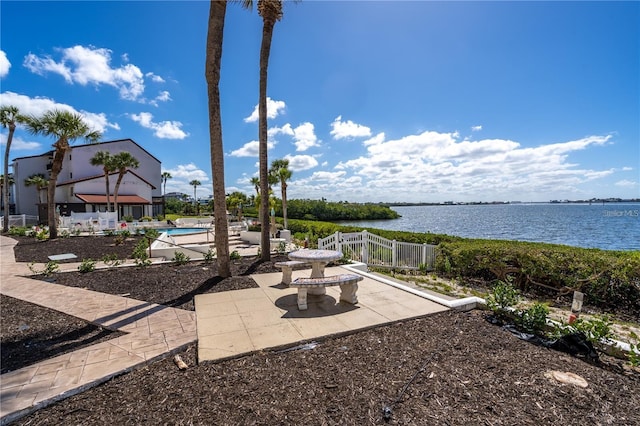 view of patio featuring a water view