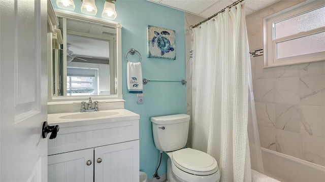 full bathroom with shower / bathtub combination with curtain, vanity, and toilet