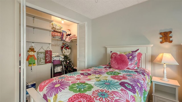 bedroom with a closet and a textured ceiling