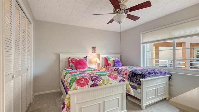 bedroom with ceiling fan and carpet