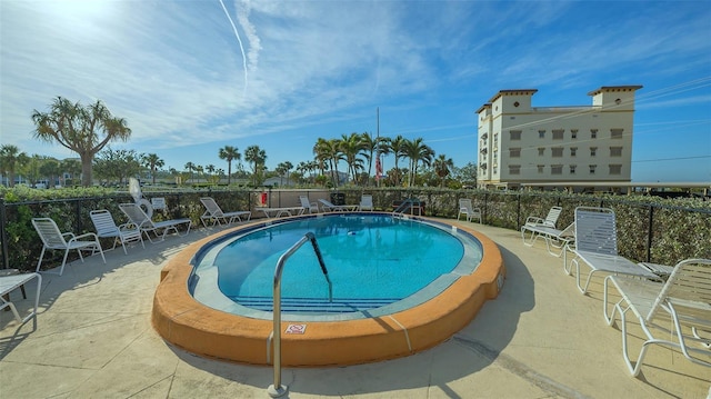 view of pool featuring a patio area