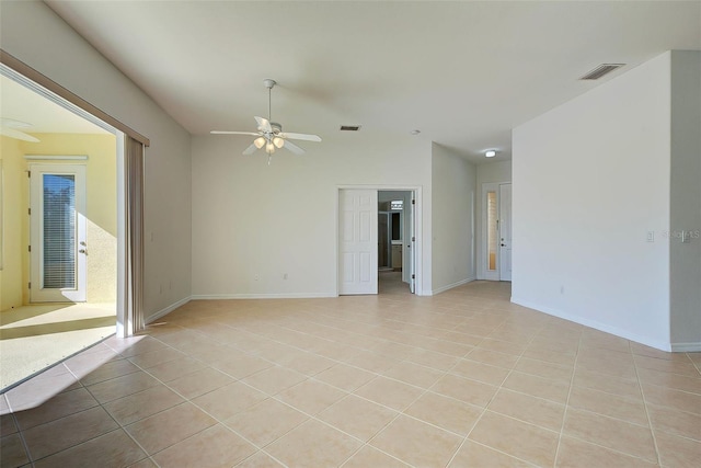 unfurnished room with light tile patterned flooring and ceiling fan