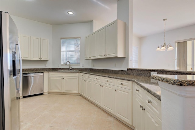 kitchen with sink, white cabinetry, and appliances with stainless steel finishes