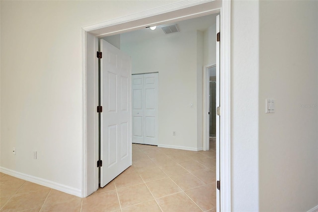 corridor with light tile patterned flooring