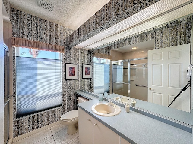 bathroom featuring walk in shower, tile patterned floors, plenty of natural light, and a textured ceiling