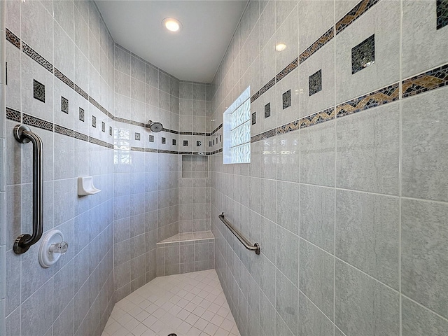 bathroom with tiled shower