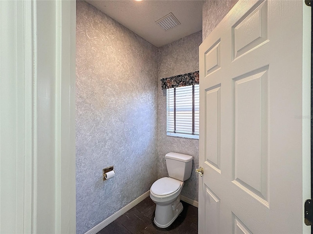 bathroom featuring toilet