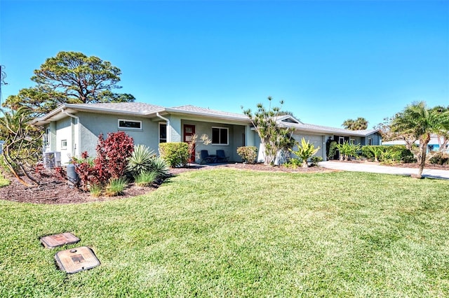 single story home with a front lawn