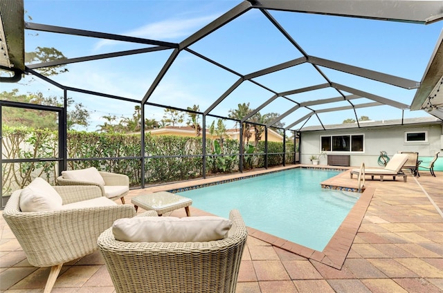 view of swimming pool with a lanai and a patio area