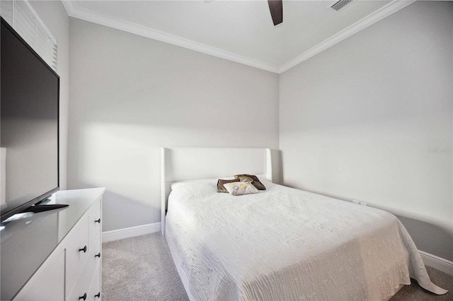 bedroom with crown molding, ceiling fan, and light colored carpet