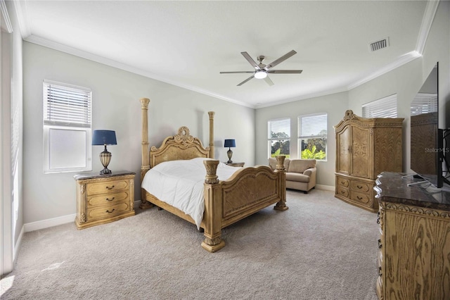 carpeted bedroom featuring ceiling fan and ornamental molding