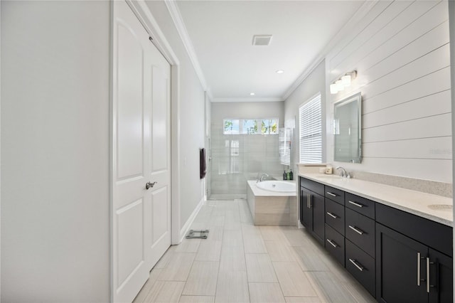 bathroom with vanity, ornamental molding, and separate shower and tub