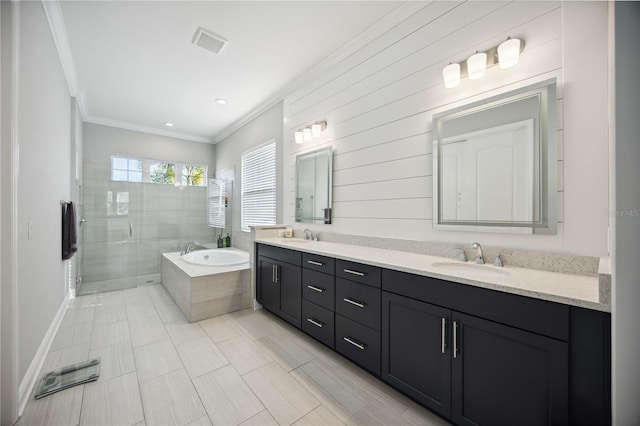 bathroom with ornamental molding, vanity, and shower with separate bathtub