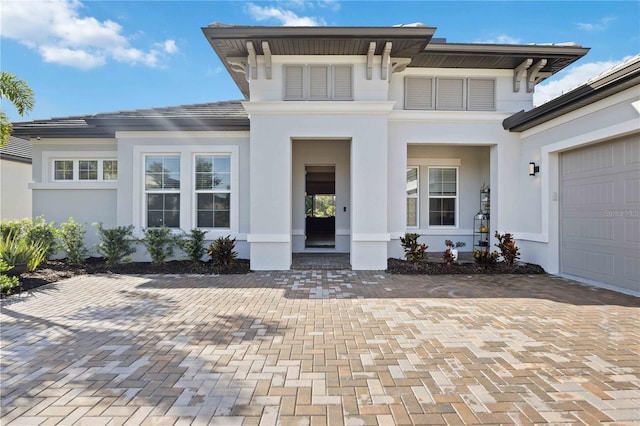 property entrance with a garage