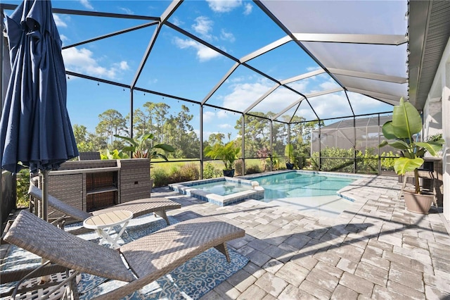 view of pool featuring an in ground hot tub, a lanai, and a patio