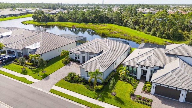 birds eye view of property with a water view