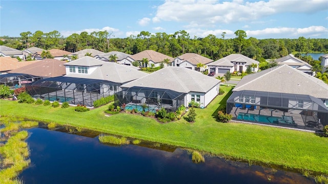 drone / aerial view with a water view