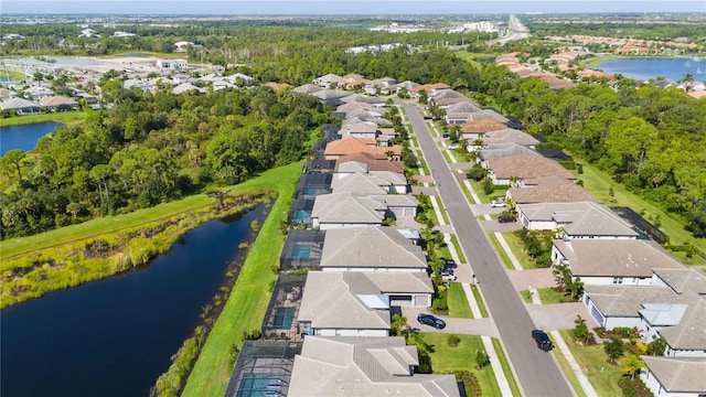 drone / aerial view with a water view