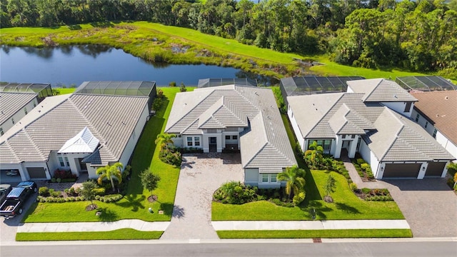 birds eye view of property with a water view