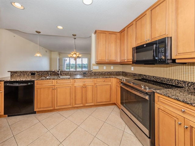 kitchen featuring light tile patterned flooring, pendant lighting, sink, dark stone countertops, and black appliances