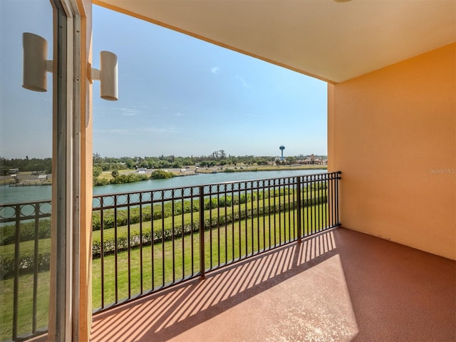 balcony featuring a water view