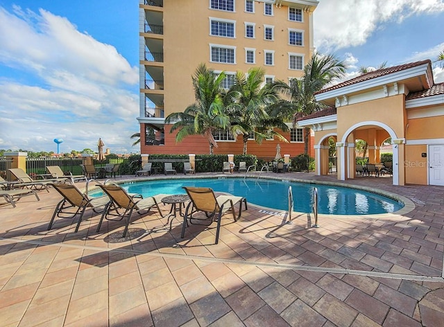 view of swimming pool with a patio area