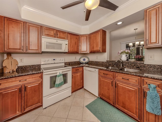 kitchen featuring sink, crown molding, white appliances, light tile patterned floors, and decorative light fixtures