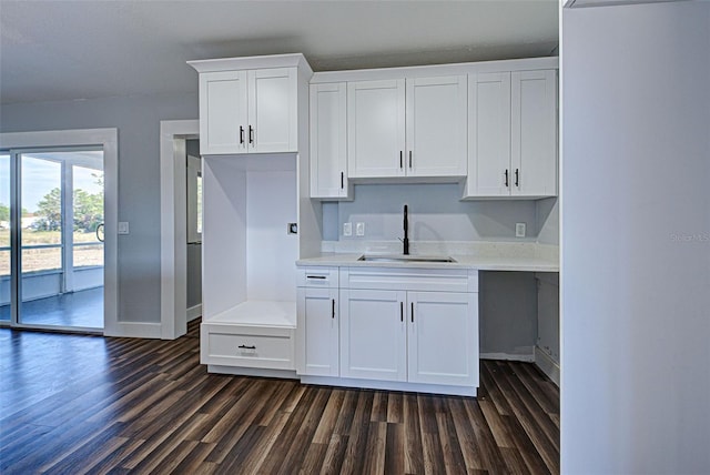 kitchen featuring sink, white cabinets, and dark hardwood / wood-style floors