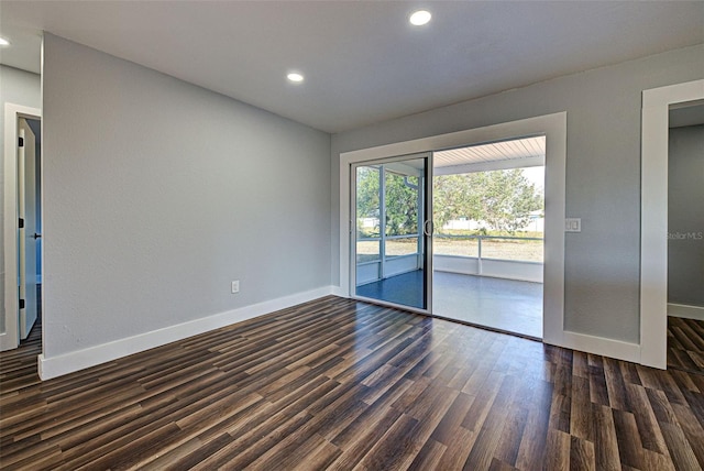 unfurnished room featuring dark hardwood / wood-style flooring