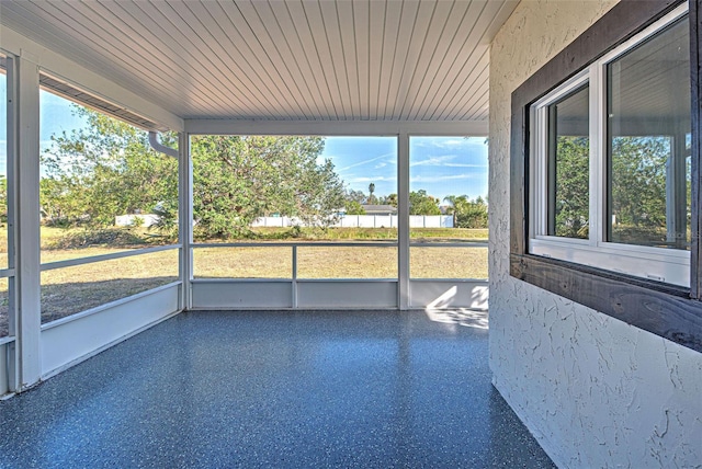 unfurnished sunroom featuring wood ceiling