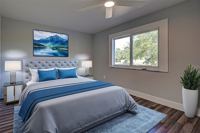 bedroom featuring ceiling fan and dark hardwood / wood-style floors