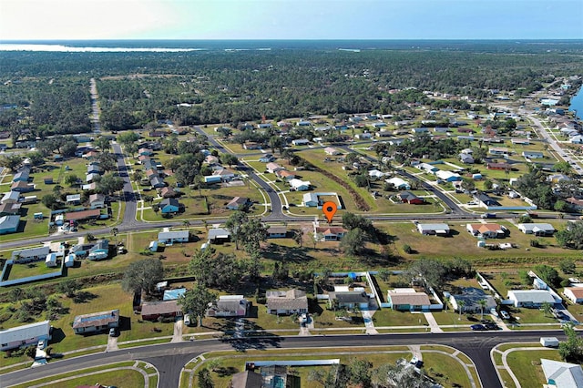 aerial view featuring a residential view and a view of trees