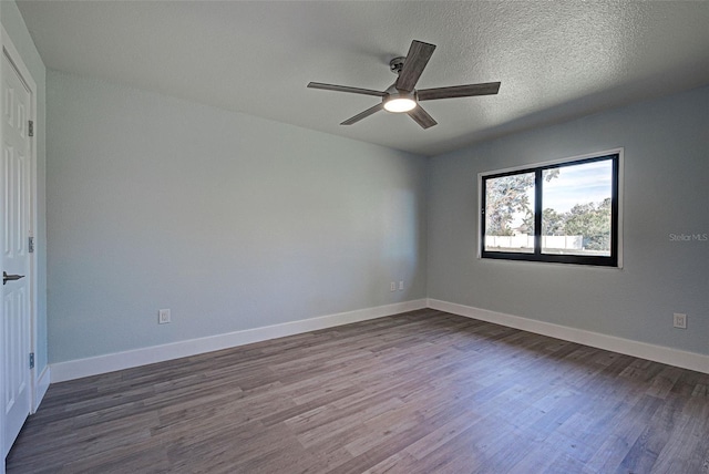 spare room with ceiling fan, hardwood / wood-style floors, and a textured ceiling