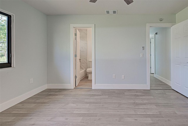 unfurnished room featuring light hardwood / wood-style flooring and ceiling fan