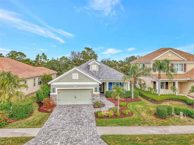 view of front of house with a garage and a front yard