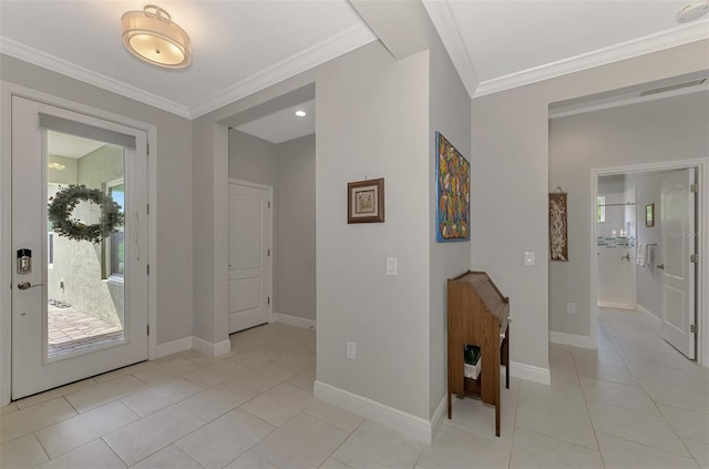 foyer entrance with crown molding and light tile patterned flooring