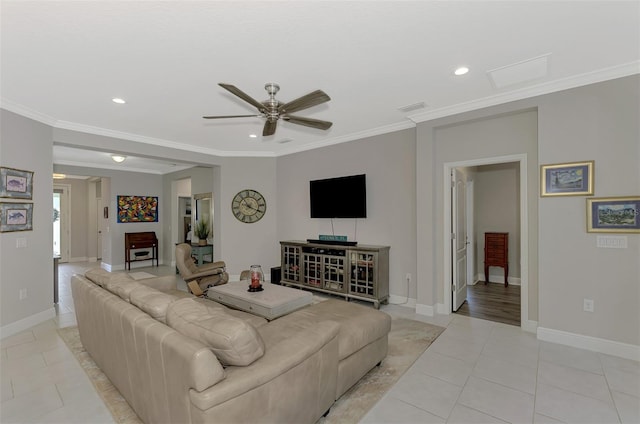 living room with ornamental molding, light tile patterned floors, and ceiling fan