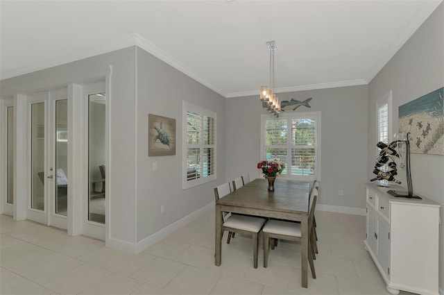 tiled dining area with crown molding and an inviting chandelier