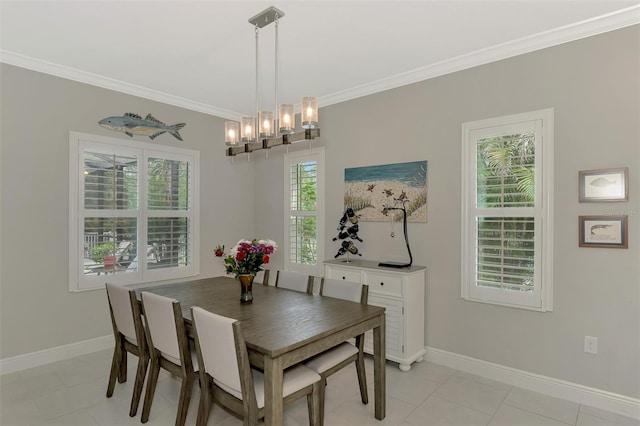 dining area with light tile patterned floors, crown molding, and plenty of natural light