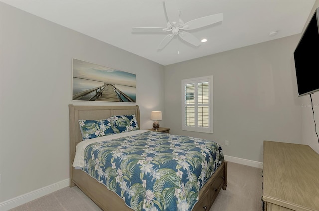 bedroom with light colored carpet and ceiling fan