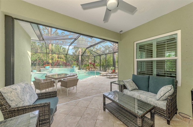 view of patio / terrace featuring ceiling fan, outdoor lounge area, and glass enclosure