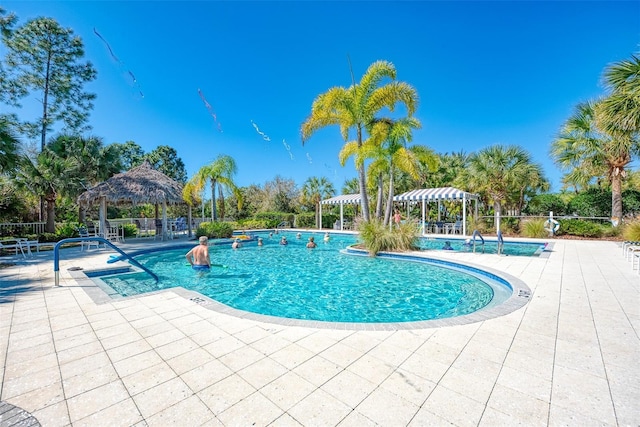 view of swimming pool featuring a gazebo and a patio