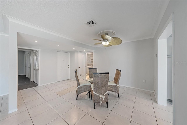 dining space with ornamental molding, light tile patterned floors, and ceiling fan