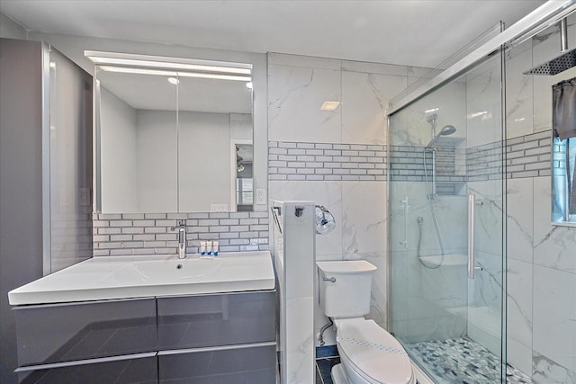 bathroom with toilet, an enclosed shower, tasteful backsplash, tile walls, and vanity