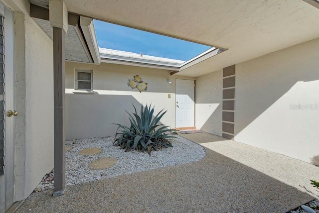 property entrance with a patio