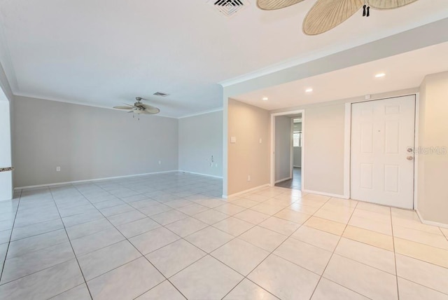 tiled empty room featuring ornamental molding and ceiling fan