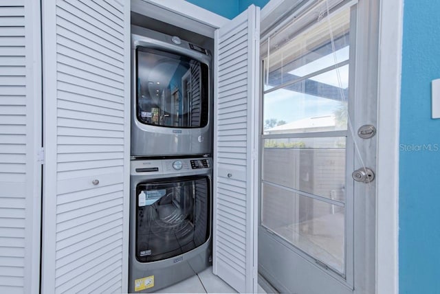 laundry area with stacked washer / dryer