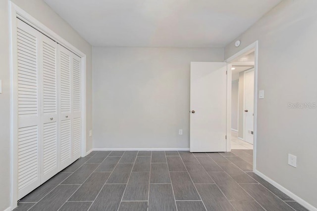 unfurnished bedroom with a closet