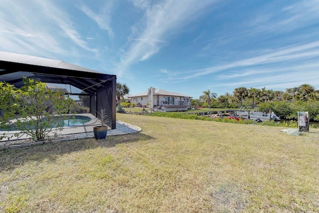 view of yard featuring glass enclosure