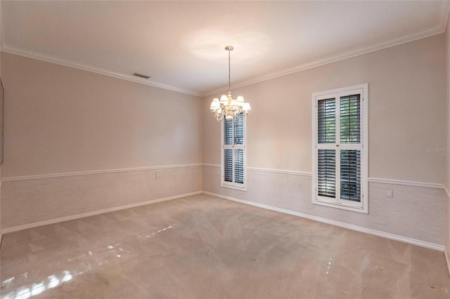 unfurnished room with a chandelier, carpet flooring, visible vents, and crown molding